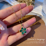 Load image into Gallery viewer, Rotating Titanium Steel Necklace with Vintage Flowers for Women Copper Micro-set Clavicle Chain Sweater Chain Green Zircon
