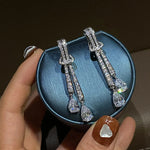 Load image into Gallery viewer, Huitan Shining Dangling Earrings Female Wedding Jewelry Silver Color Bright Drop-shaped Zirconia Pendant Accessories for Party
