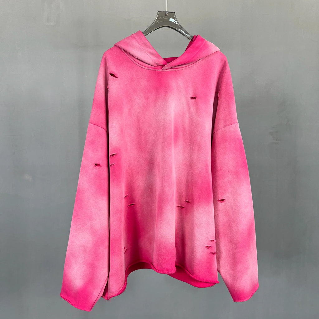 Irregular holes in the raw edge of the old wash water spray monkey hair hoodie