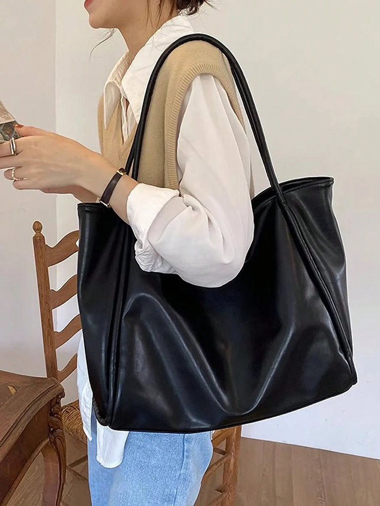 2024 new soft leather large capacity tote bag with a niche design for handheld use, single shoulder underarm bag for class and c