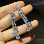 Load image into Gallery viewer, Huitan Shining Dangling Earrings Female Wedding Jewelry Silver Color Bright Drop-shaped Zirconia Pendant Accessories for Party
