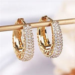 Load image into Gallery viewer, Huitan Hollow Gold Color Hoop Earrings for Women Paved Dazzling CZ Stone Luxury Trendy Female Circle Earrings Statement Jewelry
